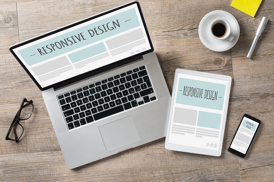 Laptop, tablet and phone showing a responsive web design